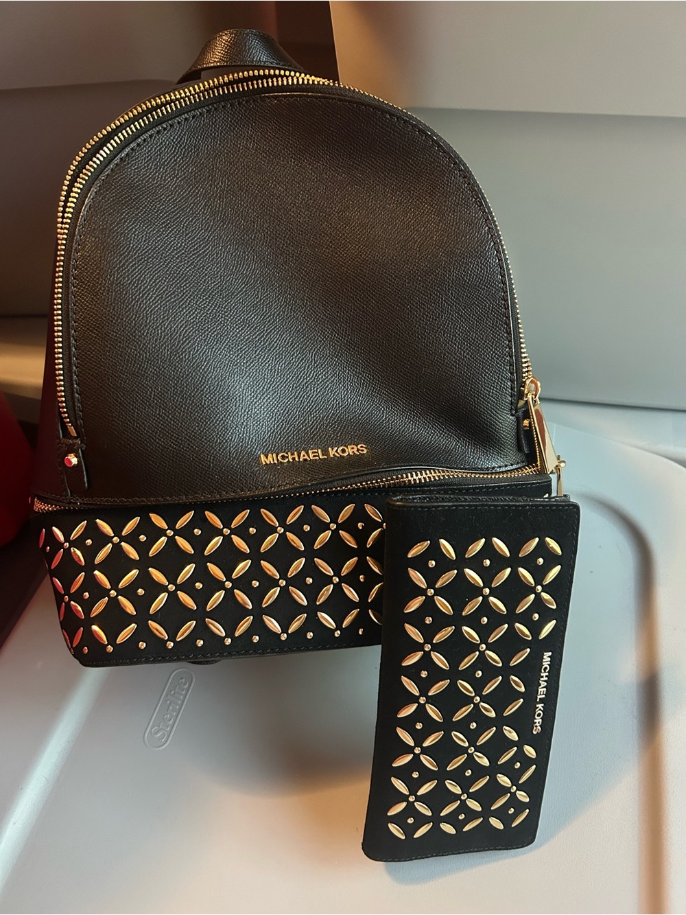 Michael Kors Black Leather Backpack and Wallet with Gold Cutout Stud Pattern